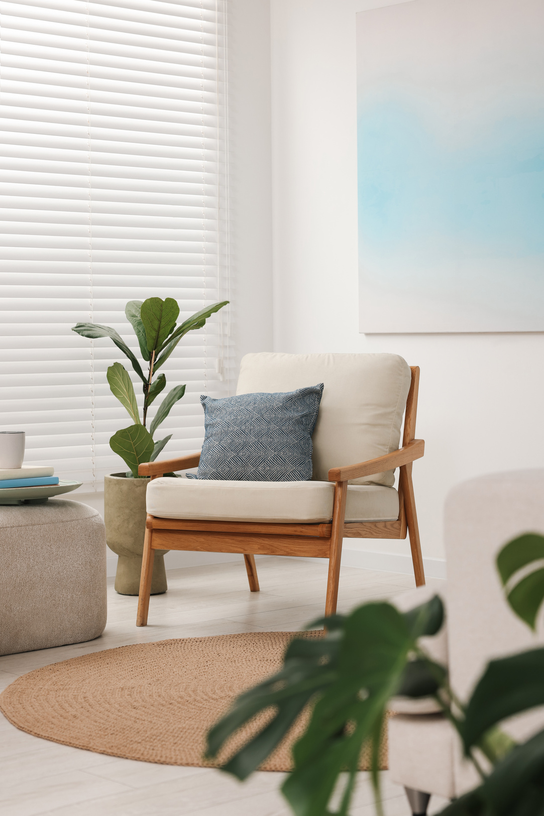 Comfortable Beige Armchair and Houseplant in Living Room. Interi